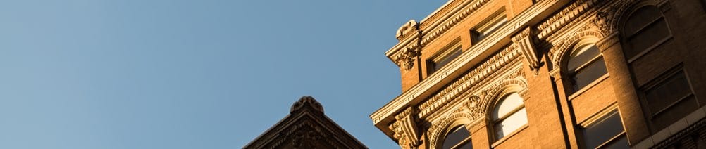 The topmost outer corner of a building.