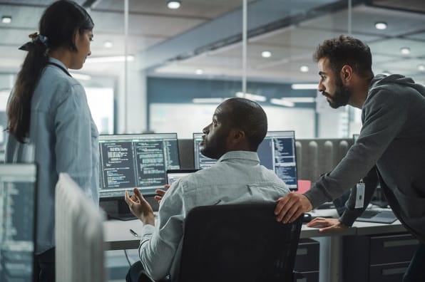 Trio of IT workers in office